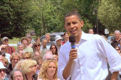 Barack Obama speaks to crowd behind him.